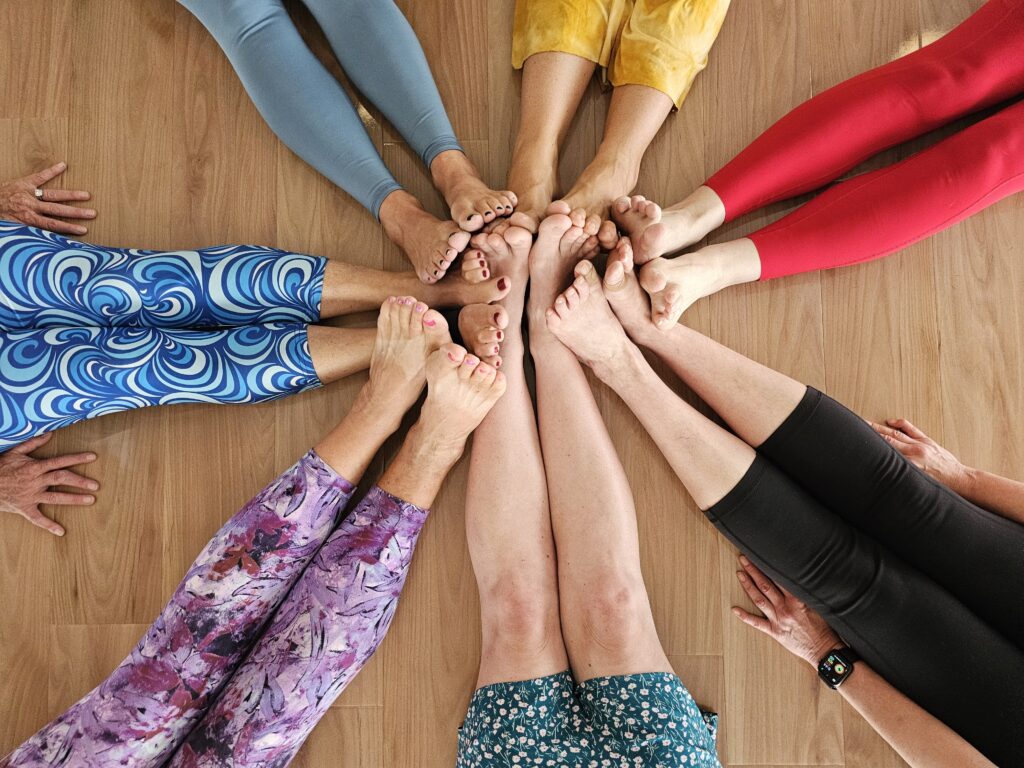 A circle of bare feet — our community